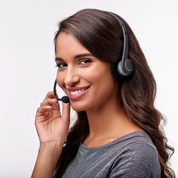 beautiful smiling woman with headset in a call centre