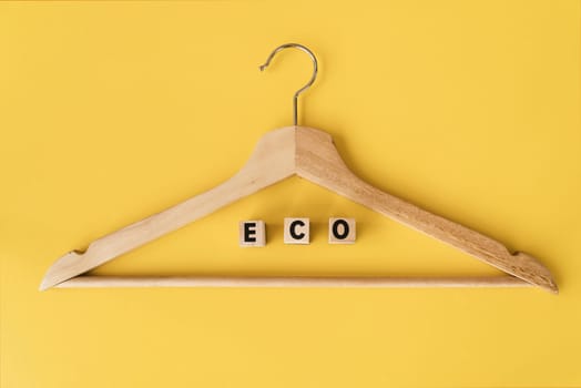 top view wooden hanger with yellow background 1. Resolution and high quality beautiful photo