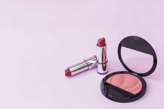 two lipsticks pink blusher pink background. Resolution and high quality beautiful photo