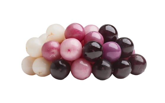 Various colorful gumballs arranged in a playful cluster, perfect for candy displays and themes. Isolated on white background.