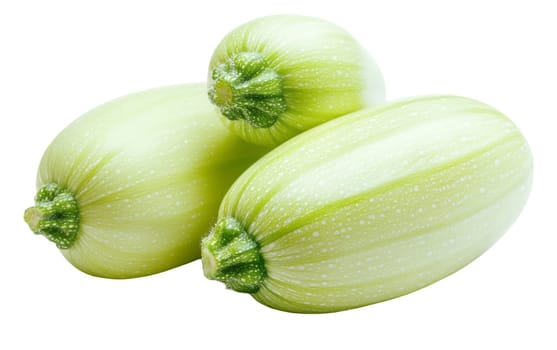 Three light green zucchinis on display, perfect for health and organic food concepts. Isolated on white background.
