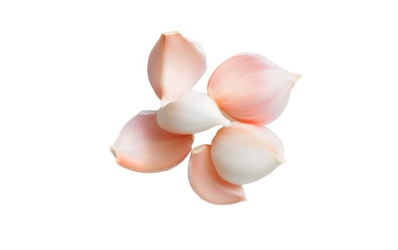 A cluster of peeled garlic cloves showcasing their soft pinkish white hues, strikingly set against a white background. Isolated on white background.
