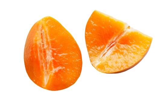 Two bright orange persimmon slices showcasing their juicy interior and smooth texture. Isolated on white background.