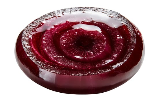 Close up of a glistening red onion slice showing its intricate layers and vibrant color. Isolated on white background.