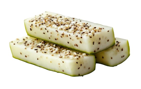 Cucumber sticks sprinkled with mixed spices for a flavorful and healthy snack, isolated on a white background. Isolated on white background.