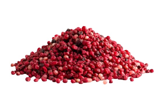 Closeup of red peppercorns piled together, showcasing their spicy flavor and vibrant color on a plain background. Isolated on white background.