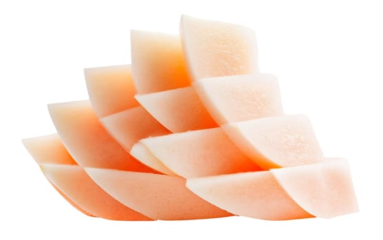 A stack of neatly sliced melon pieces, showing the soft orange hue and smooth texture. Isolated on white background.