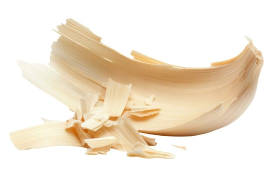 Curved and textured wood shavings isolated on a white background, highlighting their natural form and intricate details. Isolated on white background.