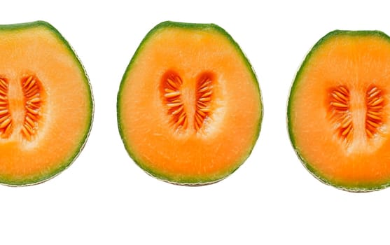 Three slices of cantaloupe with visible seeds, highlighting freshness and vibrant color. Isolated on white background.