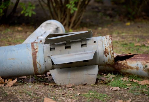 The tail section of a 220 mm rocket for the Uragan rocket fire system on a city flowerbed in Mykolaiv