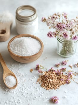 Bath salts in wooden bowls with dried flowers, creating a rustic and calming spa setting.