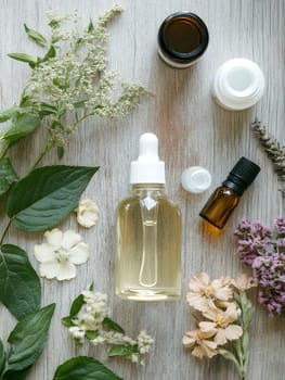 A collection of essential oils and fresh botanicals on a wooden surface, highlighting natural wellness and aromatherapy.