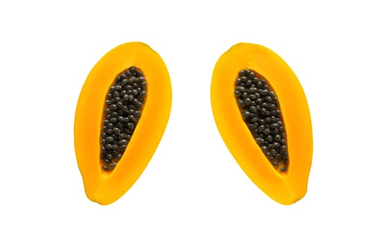 Two halves of a yellow papaya, exposing the white seeds and vibrant orange flesh, isolated on a white background. Isolated on white background.