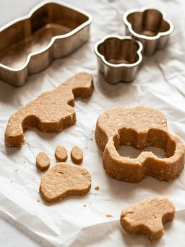 Freshly made pet treats shaped with animal-themed cutters, perfect for a homemade touch.