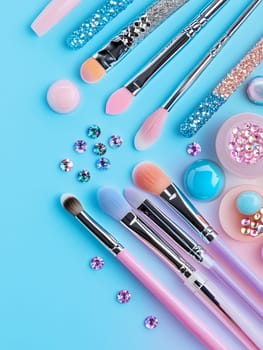 Vibrant makeup brushes and sparkling accessories on a bright blue background.