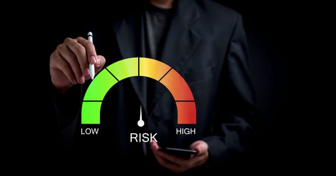 Businessman assessing risk levels with gauge. Visual metaphor for risk management, business strategy, financial analysis. Suitable for corporate presentations, management training materials.