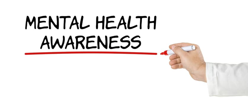 Hand with pen writing Mental Health awareness