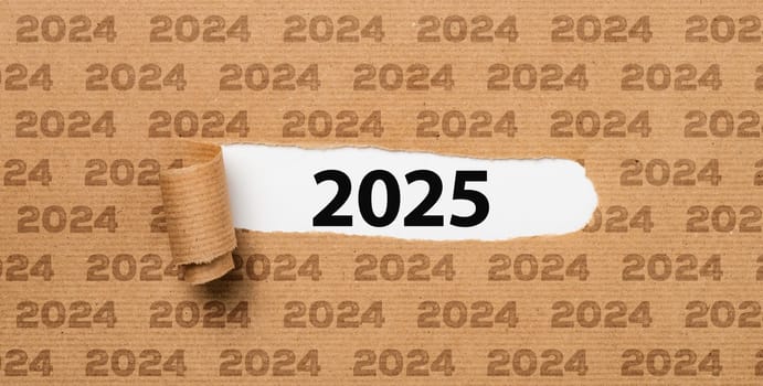 Torn paper revealing the number 2025