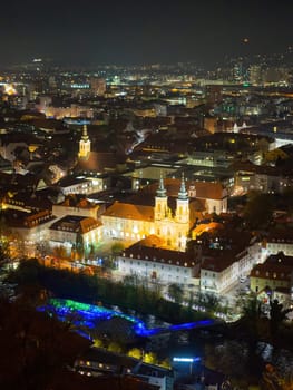 High Angle View Of Illuminated Cityscape Against Sky At Night, Graz, Austria