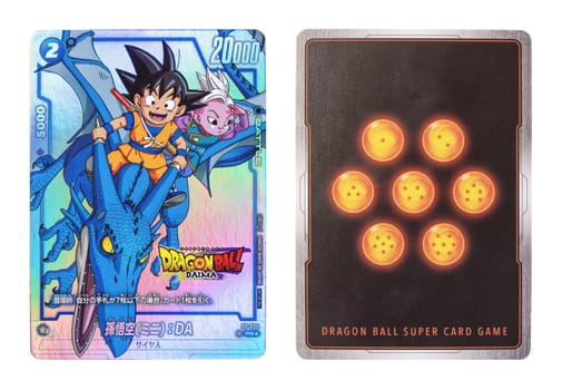 tokyo, japan - oct 06 2024: Isolated rare iridescent DRAGON BALL SUPER CARD GAME with Son Goku (Mini) and Kaiô Shin on a Pteranodon (front) and 7 dragon balls (back) from the anime "Dragon Ball Daima"""