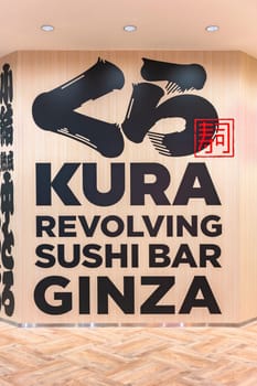 tokyo, ginza - may 14 2024: Advertising wall of the Japanese revolving sushi bar Kura Ginza, a tourist restaurant famous among tourists for its decorations inspired by the koedo cultural style.