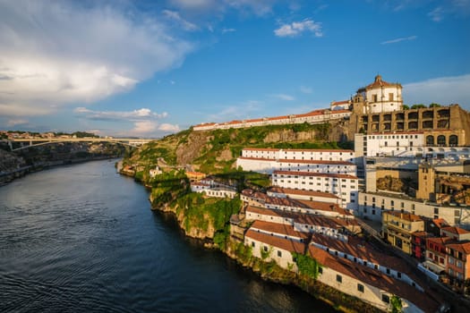 View of Vila Nova de Gaia city with Mosteiro da Serra do Pilar monastery and Douro river on sunset. Porto, Vila Nova de Gaia, Portugal