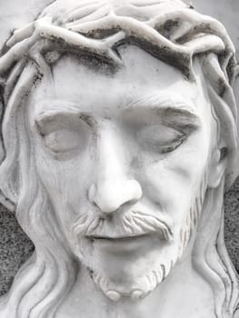 Death of Jesus. White marble statue of the face of the dying Jesus. Concepts and holidays. Easter.