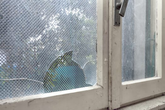 Old abandoned building. Glass of old windows broken. Abandoned house.