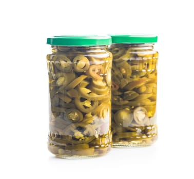 Pickled sliced jalapeno peppers isolated on a white background.