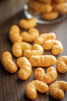 Puffed crispy Peanut flips on a wooden table.