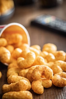 Puffed crispy Peanut flips on a wooden table.