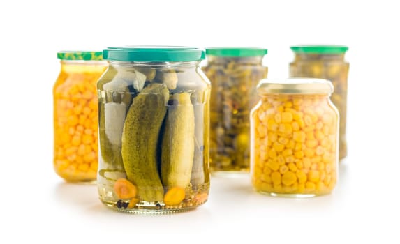 Pickles. Marinated cucumbers in jar isolated on a white background.