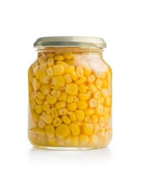 Canned sweet corn in jar isolated on a white background.