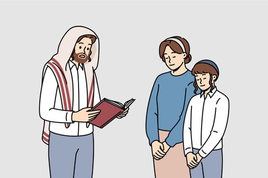 Religious jewish man reads torah to wife and son on eve of hanukkah or passover. Jewish family of father and mother together with child reading prayer and prophecies from holy book