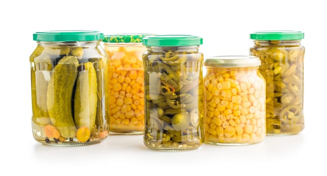 Canned vegetable. Pickled corn, cucumbers and jalapeno peppers isolated on a white background.
