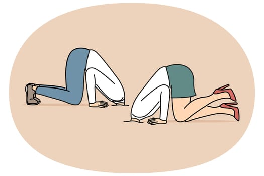 Business people hide heads in sand because of cowardice and fear problems caused by competition among employees. Business man and woman in pose of ostriches ignoring troubles due to lack of motivation