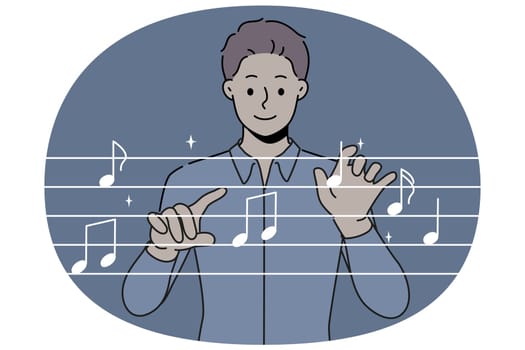 Man conductor moves hands, standing near imaginary notes and comes up with new musical composition for musicians. Conductor of symphony orchestra rehearses before going on stage to audience