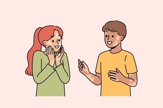 Children with vitiligo talk with smile and do not notice dermatological problems and skin pigmentation. Kids with vitiligo in good mood rejoice at presence of inclusivity or lack of discrimination