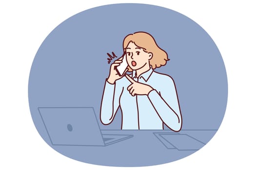 Woman office worker shockedly points to phone and makes call to partner or company manager. Businesswoman sitting in office at table with laptop surprised by new deadlines from boss
