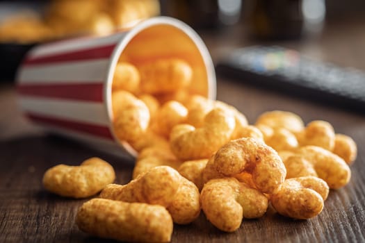 Puffed crispy Peanut flips on a wooden table.
