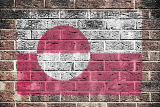 A Greenland flag painted on brick wall background