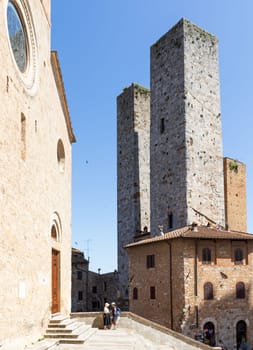 San Gimignano, Italy - 29 June 2023: Italy travel destionation, medieval tower skyscraper, blue sky