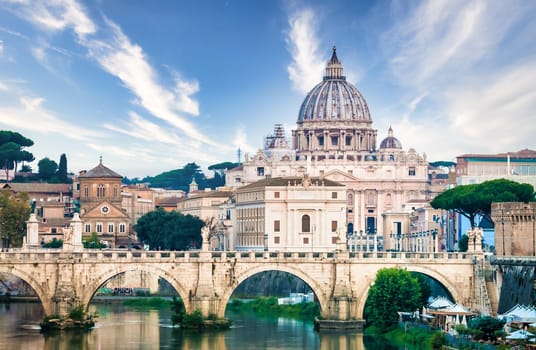 ROME, ITALY - JUNE 2023: Tiber river bridge with Vatican City and dome of Saint Peter Cathedral