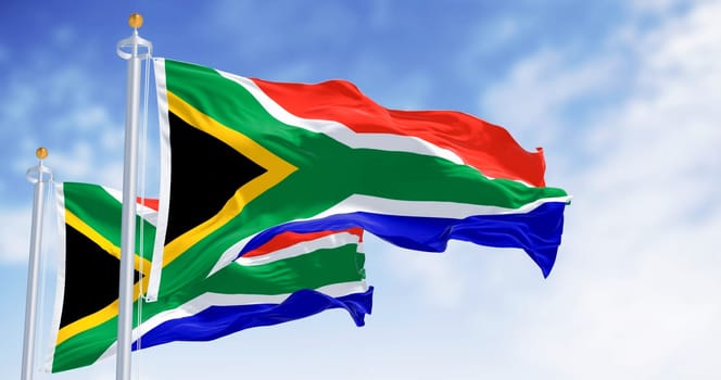 South Africa national flags waving. Red and blue flag divided by a green Y that encloses a black triangle with a yellow border. 3d illustration render. Selective focus.