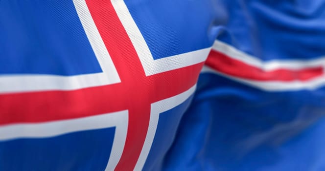 Close-up of three Iceland national flags waving. Blue with a white cross and a red cross inside the white cross. Seamless 3d render animation. Slow motion loop. Selective focus