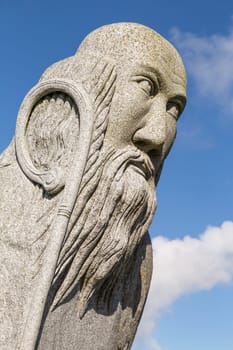 Carnoët, Bretagne, France - March 22th 2017 : Granite statue of Saint Malo by sculptor Patrice Le Guen in the Valley of the Saints in Carnoët, Brittany