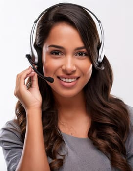 beautiful smiling woman with headset in a call centre