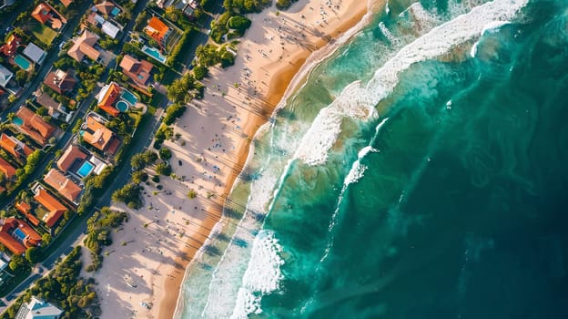 A beach with a lot of people and houses in the background. The beach is very crowded and the water is very blue