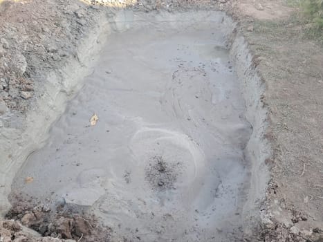 Construction workers operate heavy equipment to build a well for safe drinking water, digging deep into the ground to access clean water sources. This image captures the process of constructing a reliable water supply system in a rural area