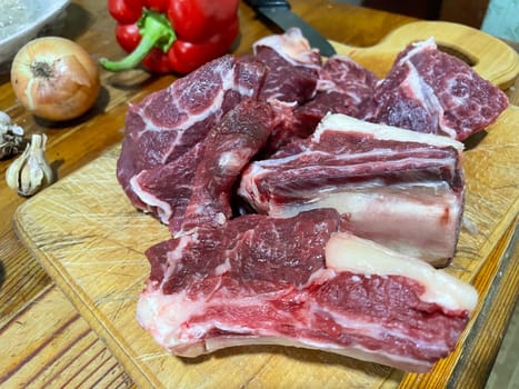 Fresh marbled veal meat displayed up-close, showcasing its fine texture and intricate marbling. This high-quality cut highlights the delicate marbling of young veal, perfect for gourmet dishes and culinary enthusiasts
